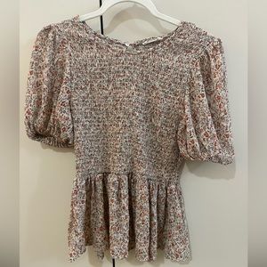 Floral peplum top with puff sleeve detail
